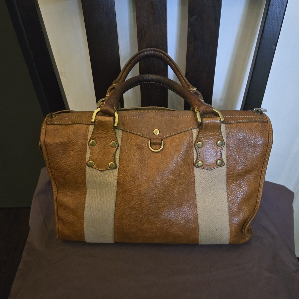 Women's Mulberry Cognac leather with tan color strap.